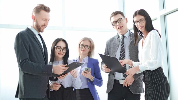 close up. smiling business team with business documents. concept of success