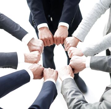 closeup.business people show a circle of hands.the concept of unity