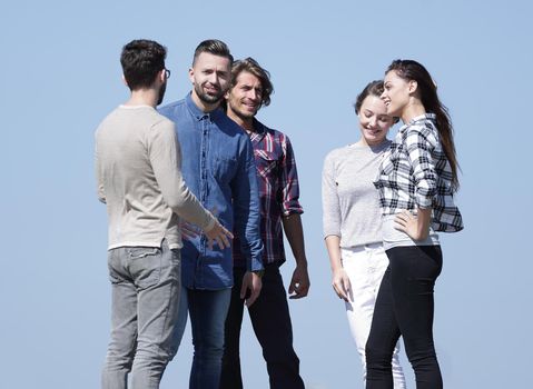 group of students talking while standing outdoors.photo with copy space