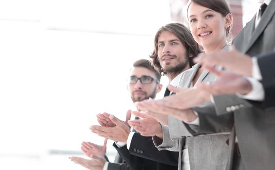 creative business team applauding, standing in a row.photo with copy space