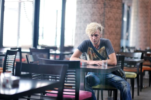 Portrait of an handsome young  man  with urban background and fashion clothes style