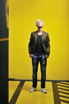 Portrait of an handsome young  man  with urban background and fashion clothes style