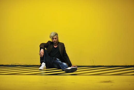 Portrait of an handsome young  man  with urban background and fashion clothes style