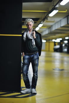 Portrait of an handsome young  man  with urban background and fashion clothes style