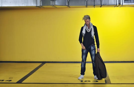 Portrait of an handsome young  man  with urban background and fashion clothes style