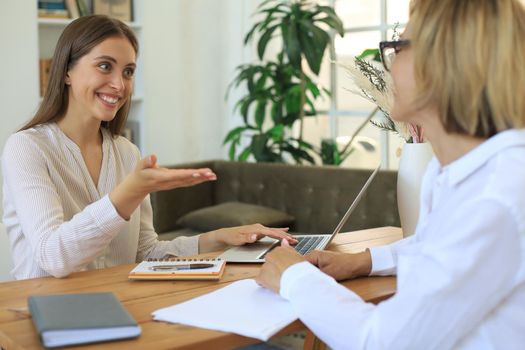 Professional middle aged female psychologist conducting a consultation