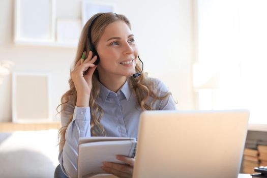 Freelance business women using tablet working call video conference with customer in workplace at home