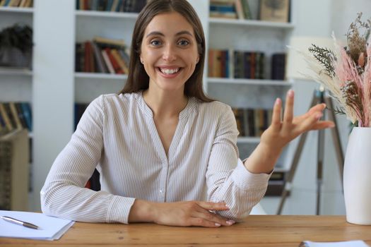 Attractive cheerful business woman working in office