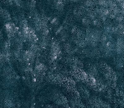 Close up abstract grunge dark blue background with brushstrokes, stains and splatter pattern