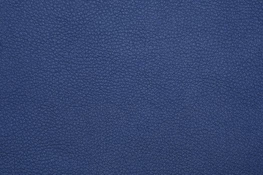 Close up background texture pattern of indigo blue natural leather grain, directly above