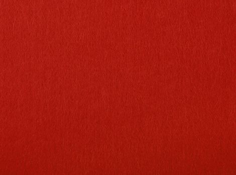 Scarlet red felt textile material background texture, close up