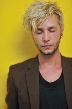 Portrait of an handsome young  man  with urban background and fashion clothes style