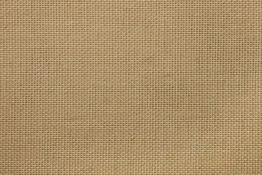 Close up natural beige rough cotton fabric canvas background texture