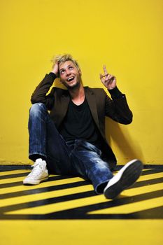 Portrait of an handsome young  man  with urban background and fashion clothes style