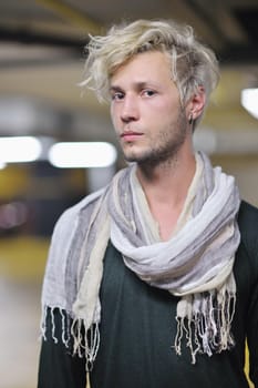 Portrait of an handsome young  man  with urban background and fashion clothes style