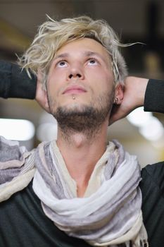 Portrait of an handsome young  man  with urban background and fashion clothes style