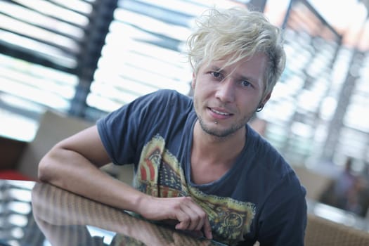 Portrait of an handsome young  man  with urban background and fashion clothes style