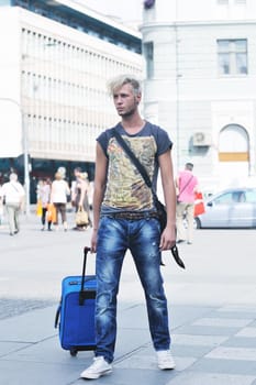 Portrait of an handsome young  man  with urban background and fashion clothes style