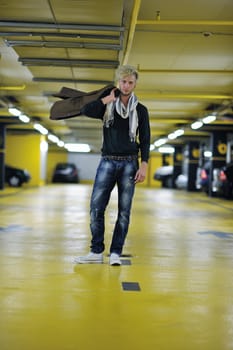 Portrait of an handsome young  man  with urban background and fashion clothes style