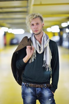 Portrait of an handsome young  man  with urban background and fashion clothes style