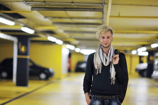 Portrait of an handsome young  man  with urban background and fashion clothes style