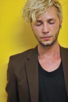 Portrait of an handsome young  man  with urban background and fashion clothes style