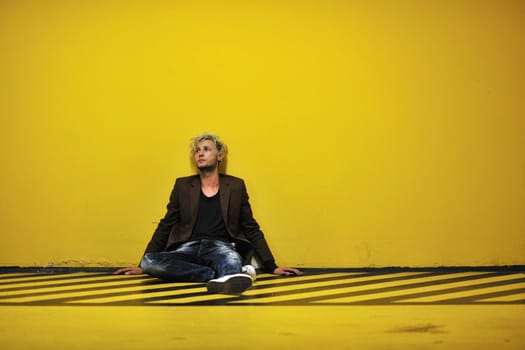 Portrait of an handsome young  man  with urban background and fashion clothes style