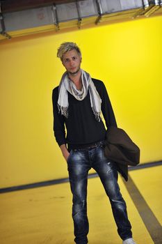 Portrait of an handsome young  man  with urban background and fashion clothes style