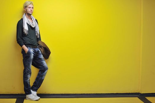 Portrait of an handsome young  man  with urban background and fashion clothes style