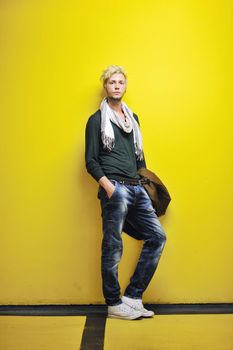 Portrait of an handsome young  man  with urban background and fashion clothes style