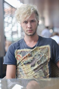 Portrait of an handsome young  man  with urban background and fashion clothes style