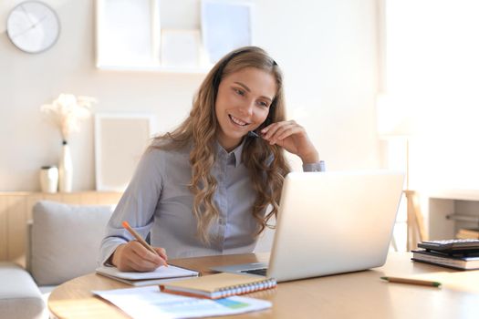 Freelance business women using tablet working call video conference with customer in workplace at home