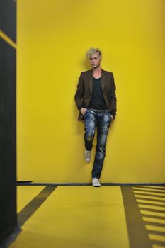 Portrait of an handsome young  man  with urban background and fashion clothes style