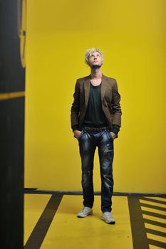 Portrait of an handsome young  man  with urban background and fashion clothes style