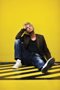 Portrait of an handsome young  man  with urban background and fashion clothes style