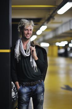 Portrait of an handsome young  man  with urban background and fashion clothes style