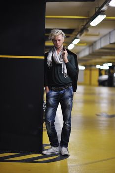 Portrait of an handsome young  man  with urban background and fashion clothes style