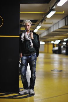 Portrait of an handsome young  man  with urban background and fashion clothes style