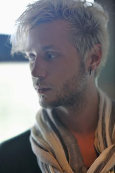 Portrait of an handsome young  man  with urban background and fashion clothes style