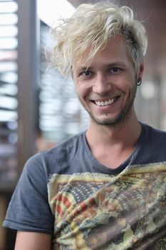 Portrait of an handsome young  man  with urban background and fashion clothes style