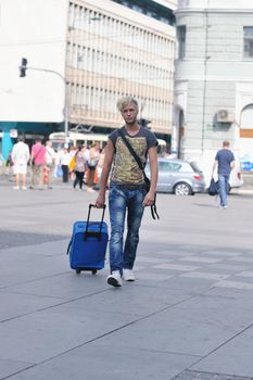 Portrait of an handsome young  man  with urban background and fashion clothes style