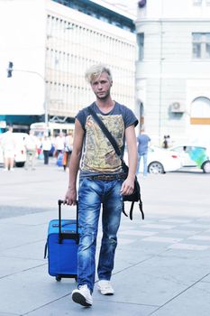 Portrait of an handsome young  man  with urban background and fashion clothes style