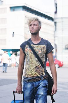 Portrait of an handsome young  man  with urban background and fashion clothes style