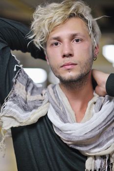 Portrait of an handsome young  man  with urban background and fashion clothes style