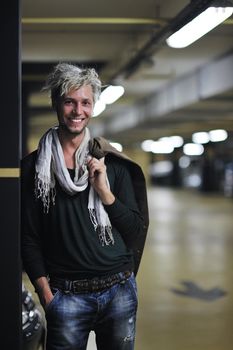 Portrait of an handsome young  man  with urban background and fashion clothes style