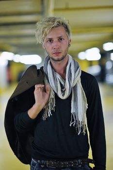 Portrait of an handsome young  man  with urban background and fashion clothes style