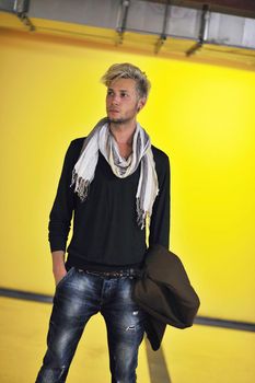 Portrait of an handsome young  man  with urban background and fashion clothes style