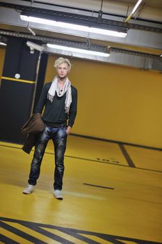 Portrait of an handsome young  man  with urban background and fashion clothes style