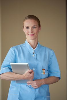 portrait of female doctor with  tablet computer at hospital