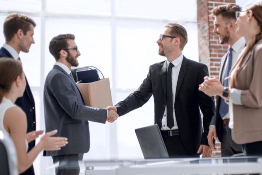 Manager shaking hands with new employee.the concept of career growth
